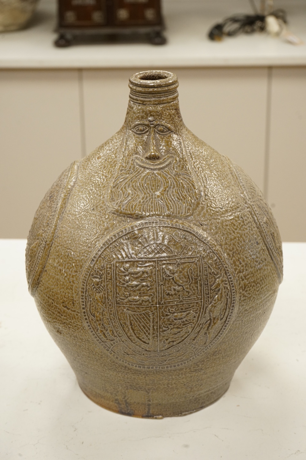 An Elizabeth II coronation commemorative large bellarmine style studio pottery jug, 32cm